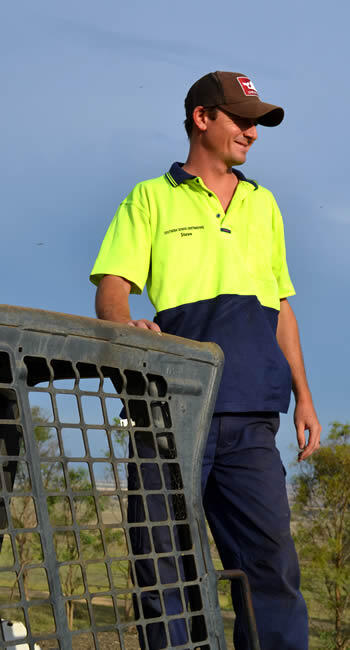 Steve Ure, Owner man in hi-vis shirt standing on side of bobcat